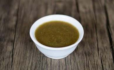 Canna edulis Ker. (ganyong) porridge on wood background.