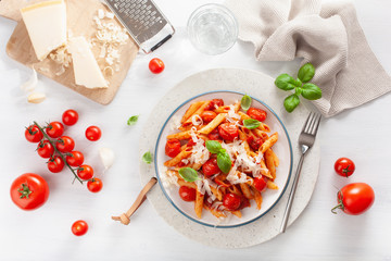 italian penne pasta with tomatoes parmesan basil