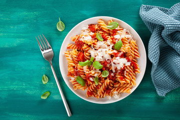 healthy fusilli pasta with tomato sauce parmesan basil - obrazy, fototapety, plakaty