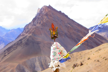 Shivas trident with tibetian flags and mountain