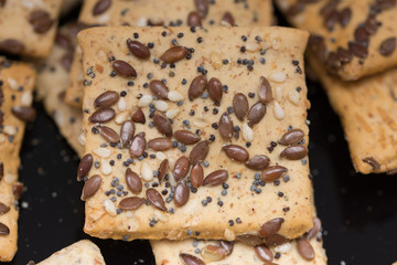  cookies with  poppy seeds and sesame seeds in a glass bowl