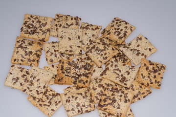  cookies with  poppy seeds and sesame seeds in a glass bowl