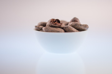 cocoa beans in a porcelain bowl