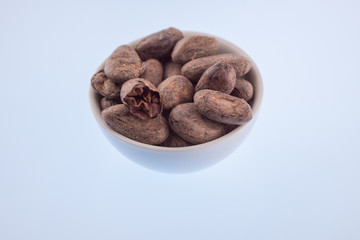cocoa beans in a porcelain bowl