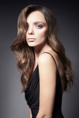 Fototapeta premium Fashion photo of beautiful lady in black dress.