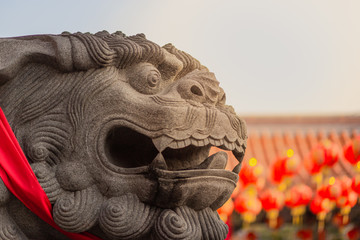 Lion statue in front of chinese on temple background, Chinese New Year concept