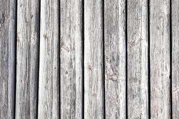Rustic wooden wall. White dry peeling paint desks background. 