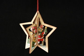 Christmas decoration,star, fir  wood on black background