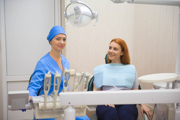 female dentists treating patient