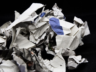 torn and crumpled newspaper