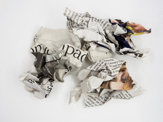 torn and crumpled newspaper