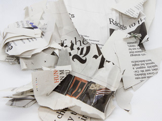 torn and crumpled newspaper