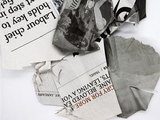 torn and crumpled newspaper