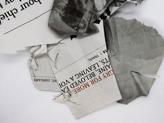 torn and crumpled newspaper
