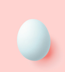 blue easter egg isolated on pink with clipping path