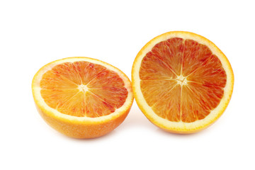 two fresh blood orange halves on a white background