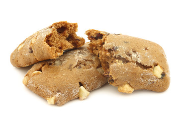 cranberry and chocolate cookies and two pieces, on a white background