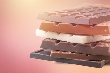 Delicious chocolates isolated on  background
