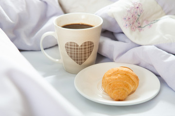 Bedroom on the bed, morning coffee. Happiness. A heart.