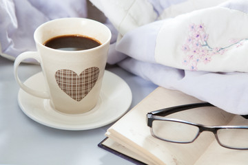 Bedroom on the bed, morning coffee. Happiness. A heart.