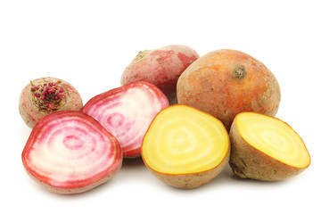 yellow beets and red chioggia beets on a white background