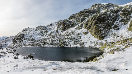 Glacial lagoon in the mountains of Madrid called Laguna Grande de Peñalara