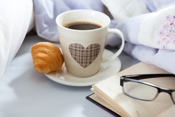 Bedroom on the bed, morning coffee. Happiness. A heart.