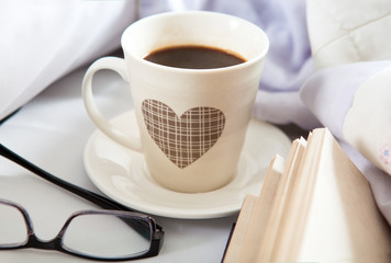 Bedroom on the bed, morning coffee. Happiness. A heart.
