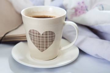 Bedroom on the bed, morning coffee. Happiness. A heart.