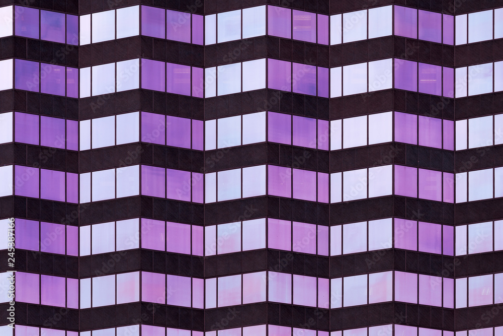 Wall mural Architectural abstract of purple and blue glass windows of modern skyscraper in downtown Tampa, Florida