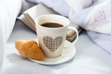 Bedroom on the bed, morning coffee. Happiness. A heart.