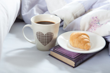 Bedroom on the bed, morning coffee. Happiness. A heart.