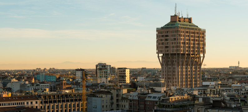 Milan (Italy) skyline with Velasca Tower (Torre Velasca) at sunset. This famous skyscraper, approximately 100 metres tall, was built in the fifties.
