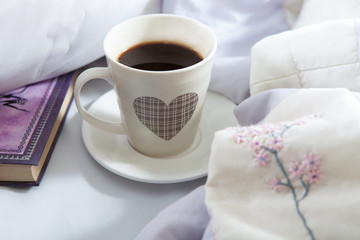 Bedroom on the bed, morning coffee. Happiness. A heart.