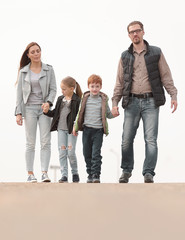 modern family with two children walking together