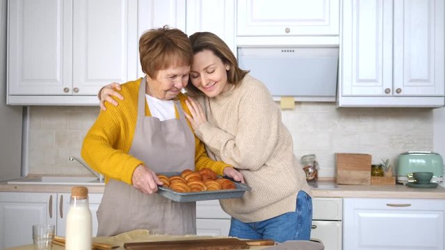 Happy Family, Generation, Elderly Care Concept. Grandmother and Granddaughter Cooking Together.