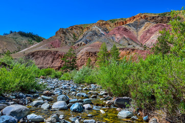 View of unrealy beautiful colorful clay cliffs in Altai mountains, Russia