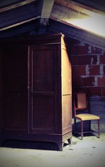 gloomy attic with an old wooden wardrobe with old effect