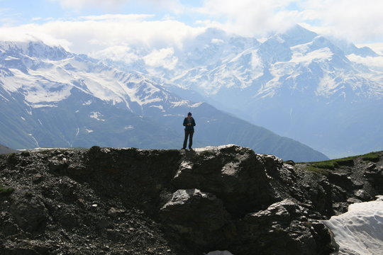 man on top of mountain
