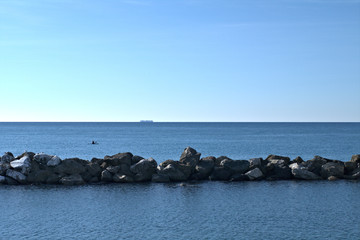 sea and rocks,horizon,sky,water,blue,container ship,seascape,