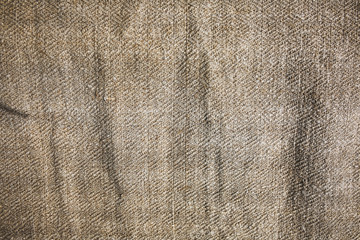 Old rustic linen tablecloth napkin. Natural vintage background texture.