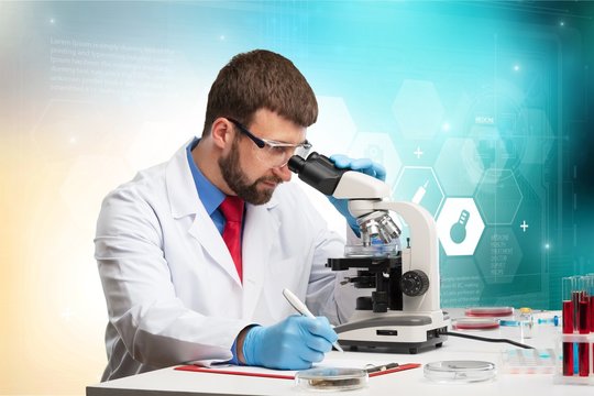 Young male scientist Working with Microscope