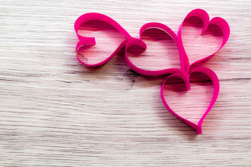 Pink heart made of paper,placed on wooden floor,Valentine's Day concept