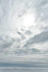 Blue sky background, viewed from an airplane window.