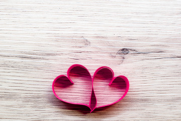 Pink heart made of paper,placed on wooden floor,Valentine's Day concept