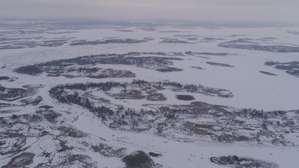 Frozen river and forest in snow view Fromm 500 meter , drone shoot ,areal photo 
