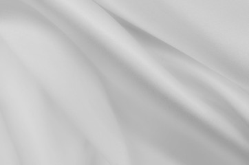 Smooth elegant white silk or satin luxury cloth texture. Can use as wedding background.