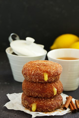 Donuts with cinnamon and lemon cream. Homemade baking. Selective focus.