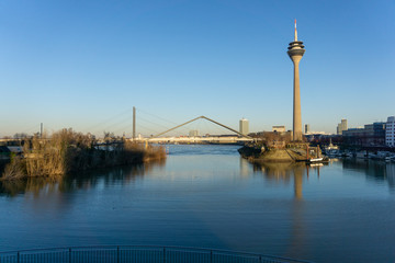 Duesseldorf, GERMANY - January 20, 2019: Modern architecture of New Harbour City is touched by warm light of sinking sun