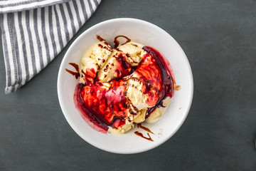 delicious vanilla ice cream with raspberry sauce
